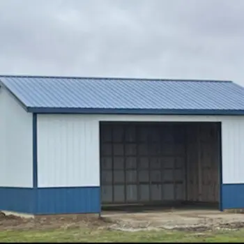 Metal shed with blue roof