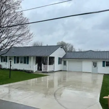 White house metal roofing driveway